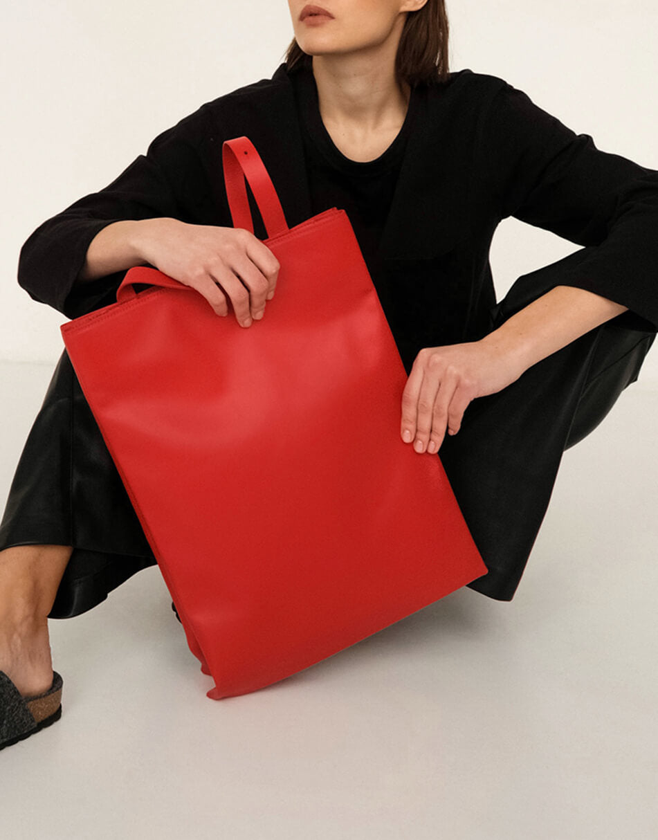 A girl with a red bag