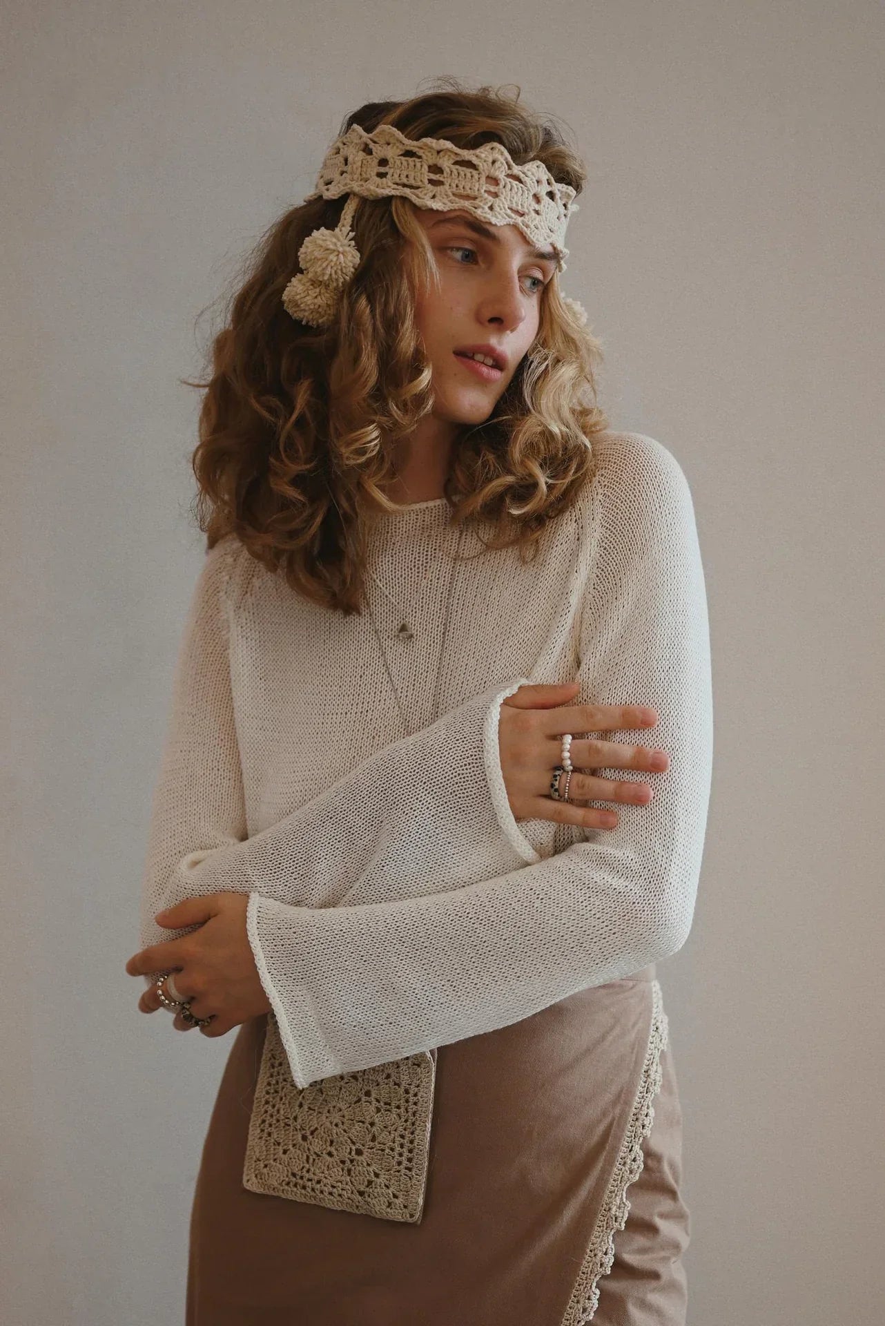 A woman with brown hair wearing a longsleeve